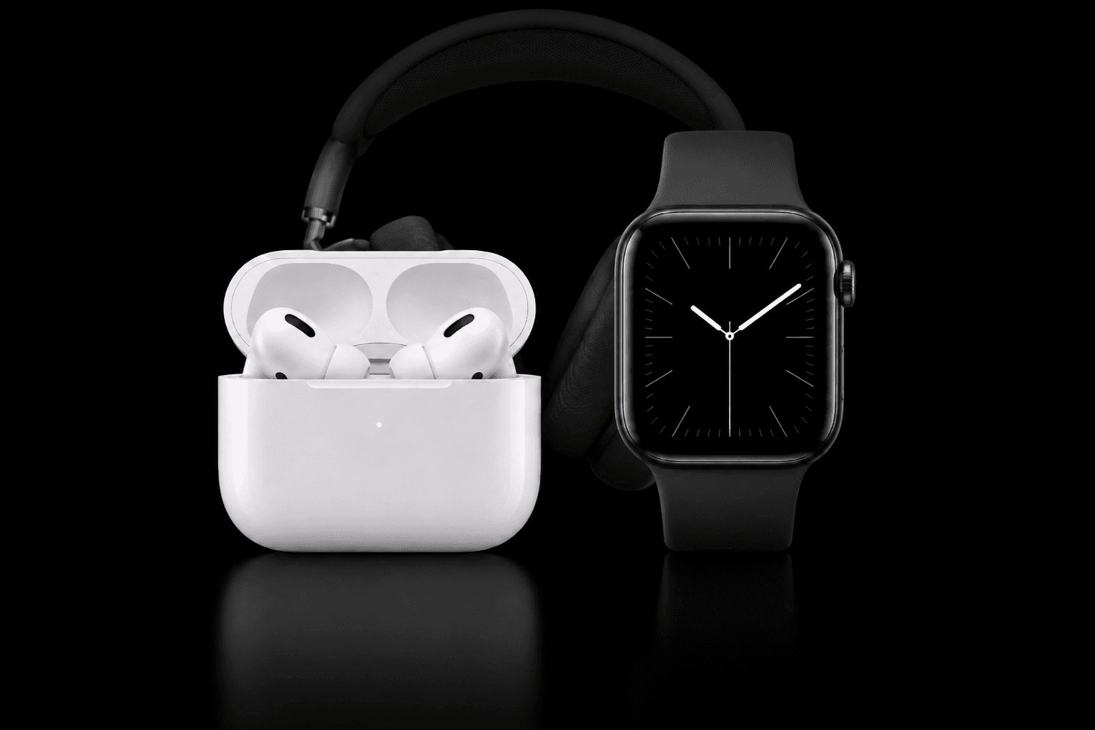 AirPods, over-ear headphones, and Apple Watch on black