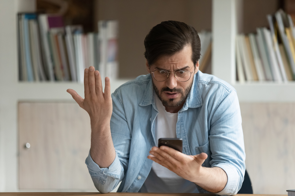 Man frustrated with his Android cell phone