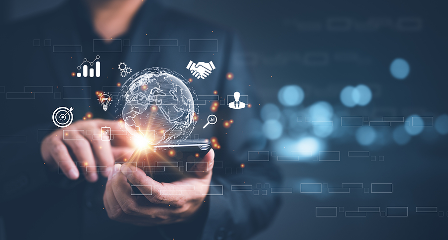 Businessman using a smartphone with digital icons representing data, security, and global connectivity.