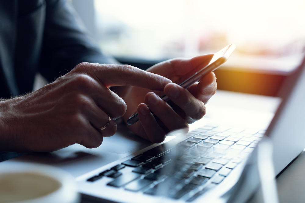 hands texting on a mobile phone