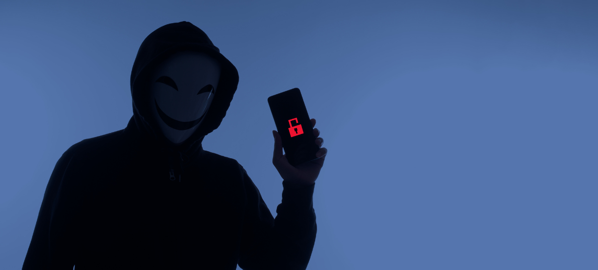 Hacker holding a phone