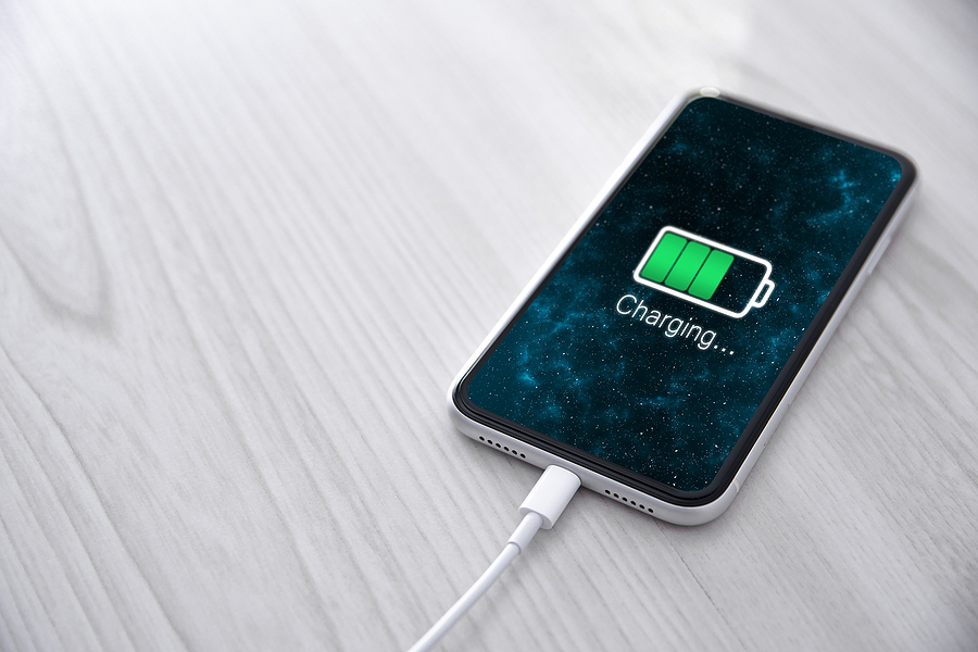 Mobile phone plugged into charger.