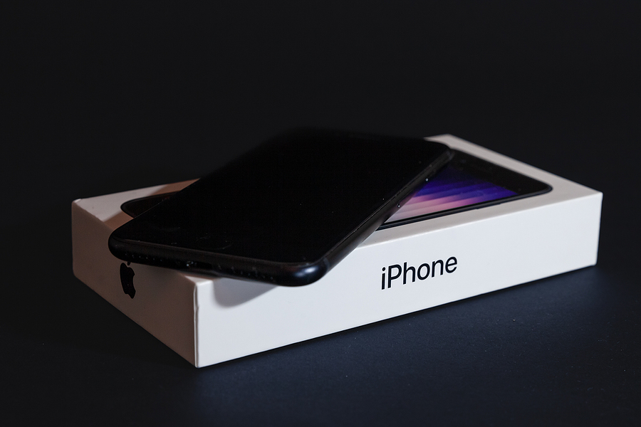 iPhone sitting on its box