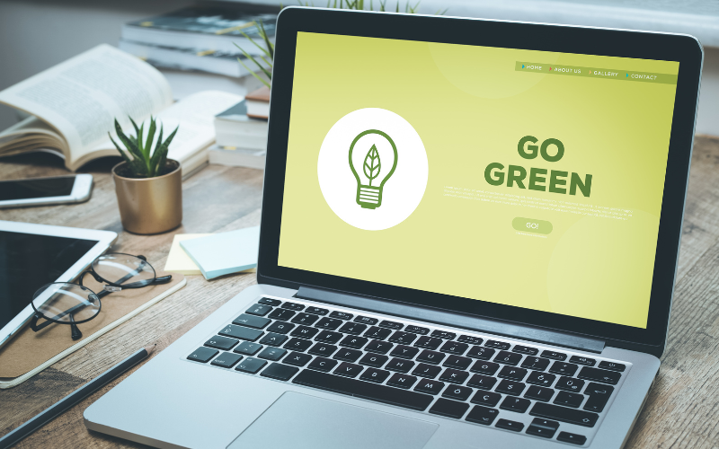 Laptop with screen saying Go Green