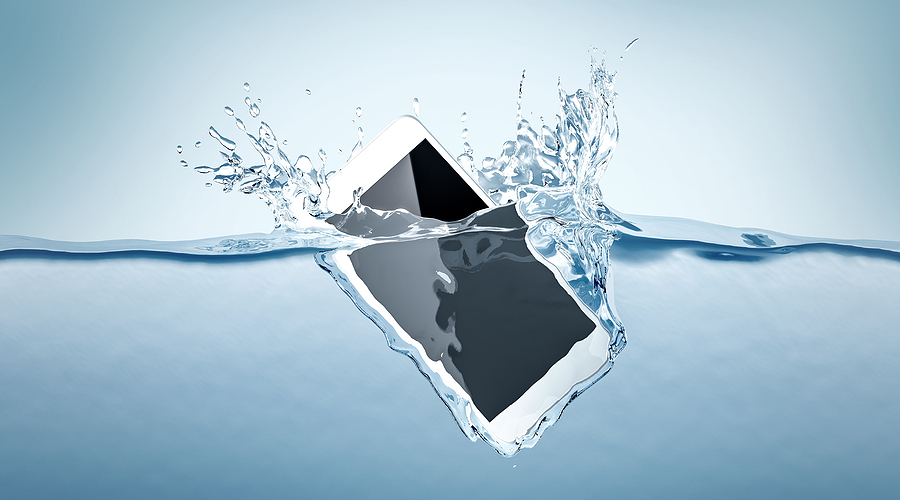 Mobile phone submerged in water.