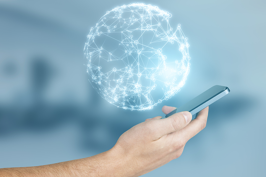 Hand holding iPhone with planet over it